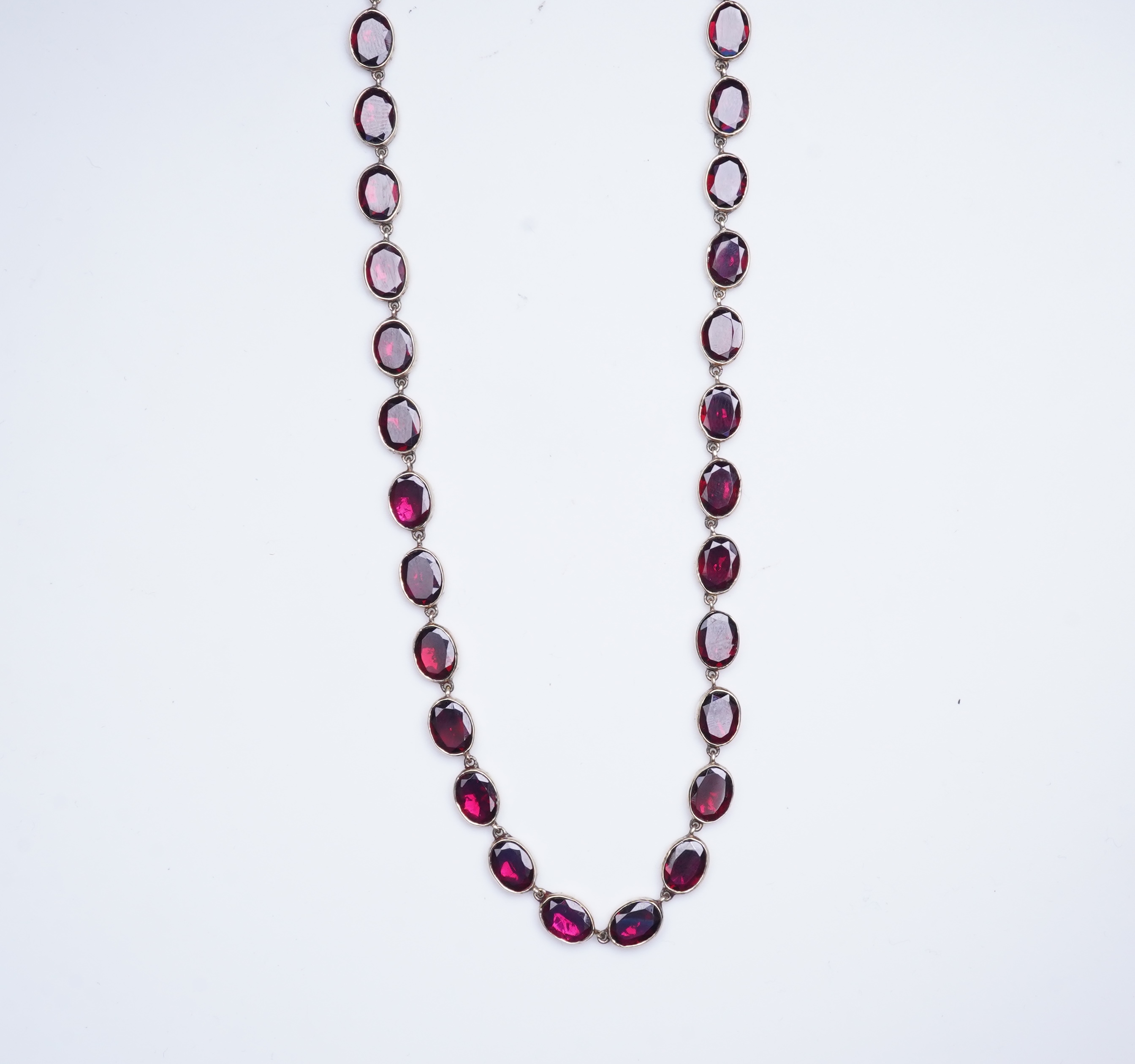 A garnet rivière necklace, circa 1970